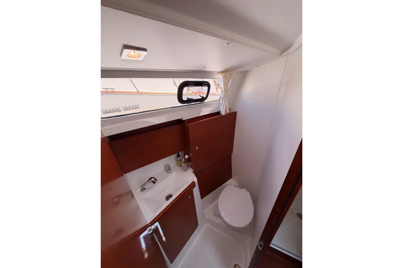 Slide: The Image of Interior of 2018 Beneteau Oceanis 35.1 yacht bathroom with sink and toilet. - 52