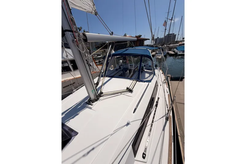 Slide: The Image of 2018 Beneteau Oceanis 35.1 sailboat docked in a sunny marina. - 15