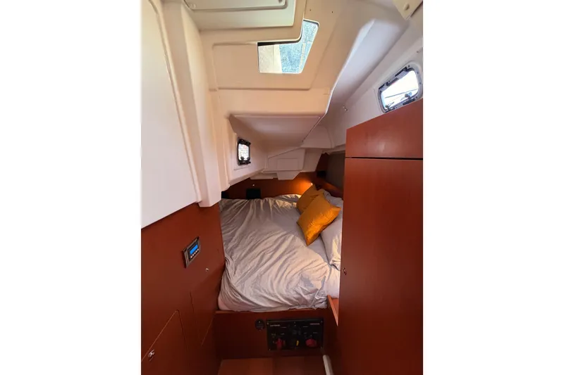 Slide: The Image of Cozy cabin interior of 2018 Beneteau Oceanis 35.1 with bed and portholes. - 45
