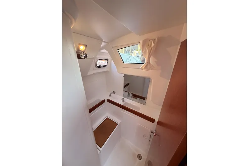 Slide: The Image of Interior of 2018 Beneteau Oceanis 35.1 yacht bathroom with modern fixtures and window. - 51