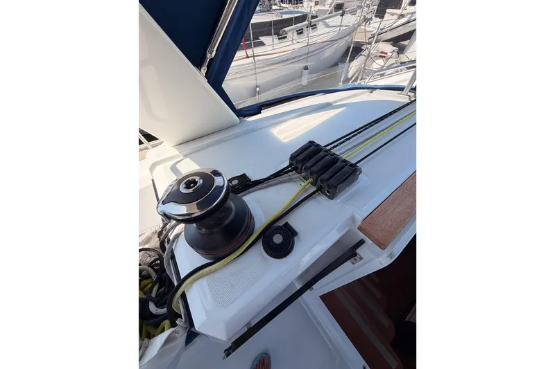 Slide: The Image of Deck view of 2018 Beneteau Oceanis 35.1 sailboat with winch and ropes. - 34