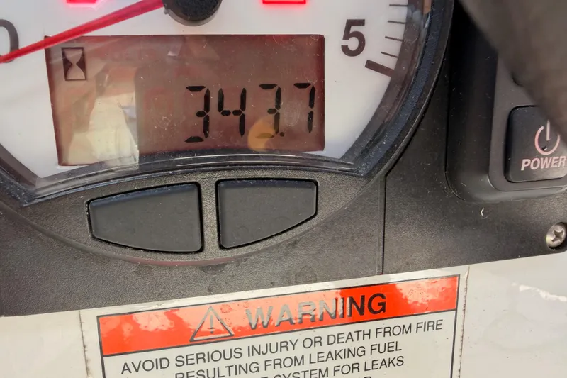 Slide: The Image of Close-up of Beneteau Oceanis 35.1 engine hour meter displaying 3427 hours, with warning label. - 72