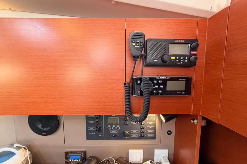 Slide: The Image of Interior of 2018 Beneteau Oceanis 35.1 yacht with communication equipment and control panel. - 59