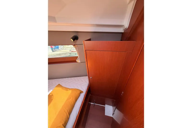 Slide: The Image of Interior cabin of 2018 Beneteau Oceanis 35.1 with wooden finish and cozy bedding. - 64