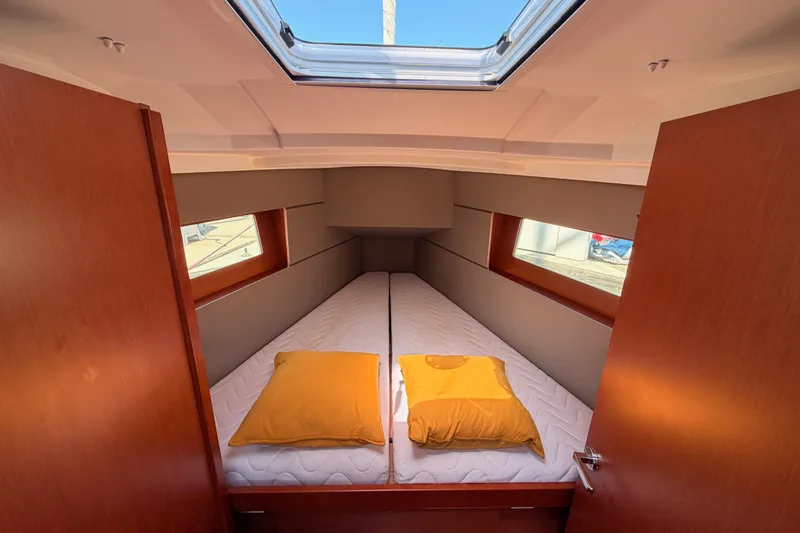 Slide: The Image of Interior cabin of 2018 Beneteau Oceanis 35.1 yacht with twin beds and skylight. - 61