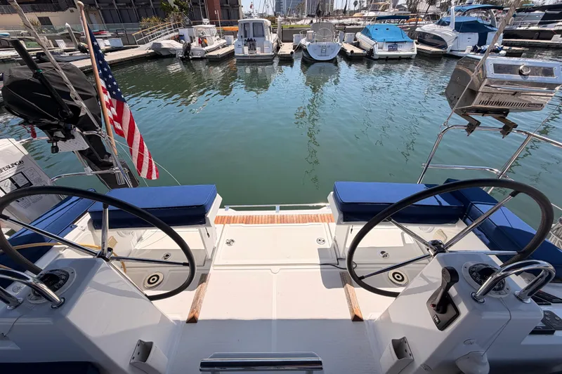 Slide: The Image of Cockpit view of a 2018 Beneteau Oceanis 35.1 yacht docked at a marina. - 20