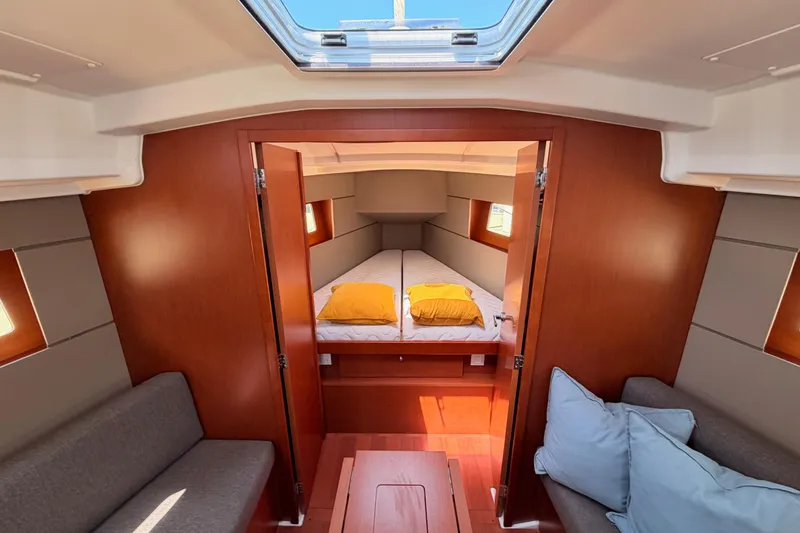 Slide: The Image of Interior of 2018 Beneteau Oceanis 35.1 yacht, featuring cozy cabin and modern design. - 60