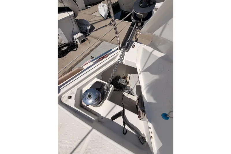 Slide: The Image of Anchor locker of a 2018 Beneteau Oceanis 35.1 sailboat, featuring chain and windlass. - 13