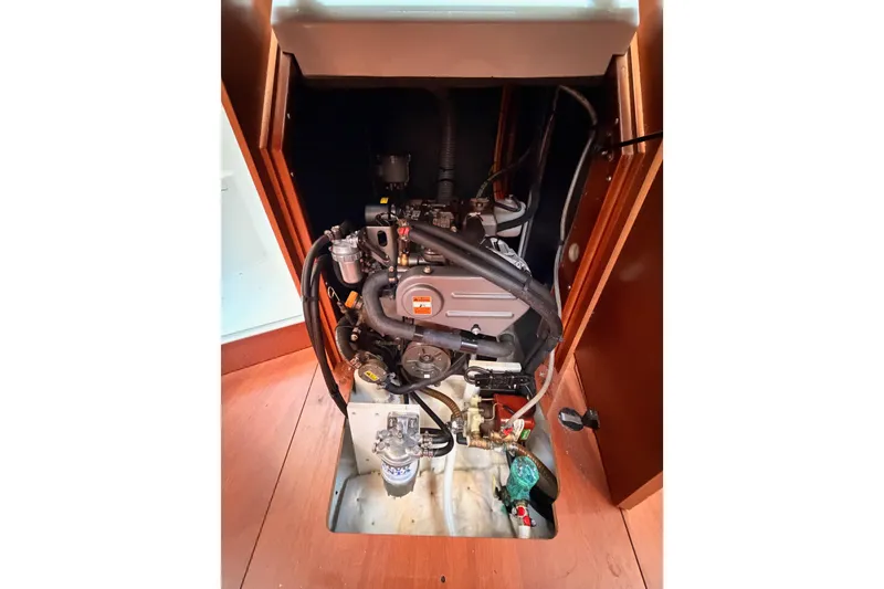 Slide: The Image of Engine compartment of a 2018 Beneteau Oceanis 35.1 sailboat, showcasing mechanical components. - 69