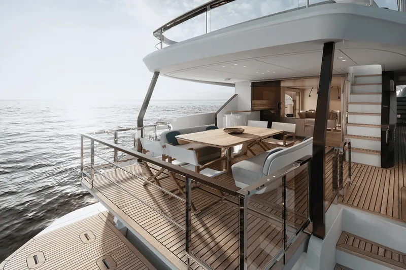 Slide: The Image of Azimut Grande 26M 2027: Luxurious deck with dining table, surrounded by ocean views. - 12