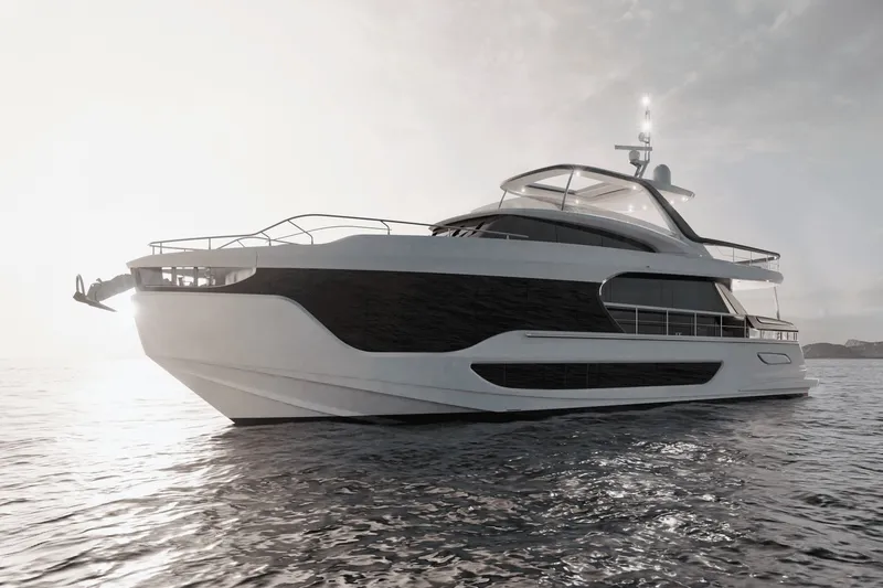 Slide: The Image of The 2027 Azimut Grande 26M glides elegantly on the water at sunset. - 8