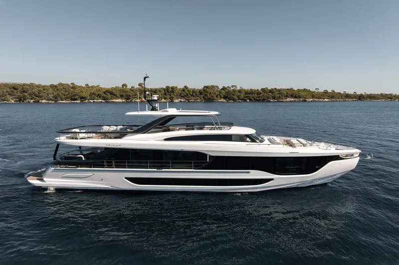 Slide: The Image of The 2027 Azimut Grande 26M is a luxurious yacht on calm waters, featuring a sleek, modern design. - 4