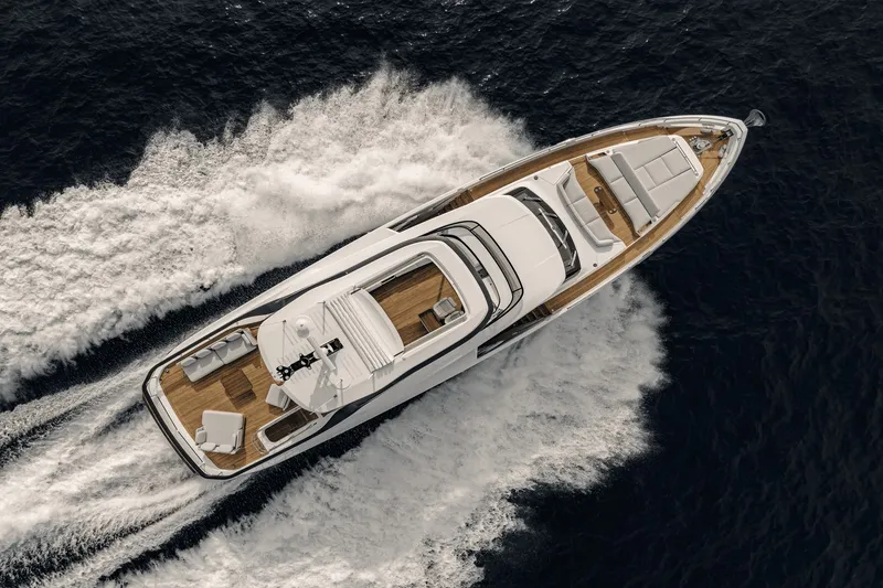Slide: The Image of Aerial view of a luxurious Azimut Grande 26M yacht cruising swiftly over the sea. - 10