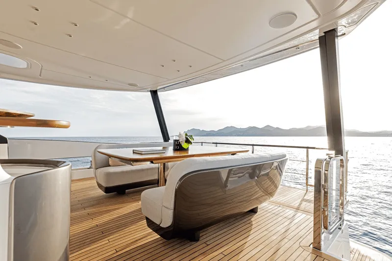 Slide: The Image of Luxurious deck of the Azimut Grande 26M with elegant seating and ocean view. - 26
