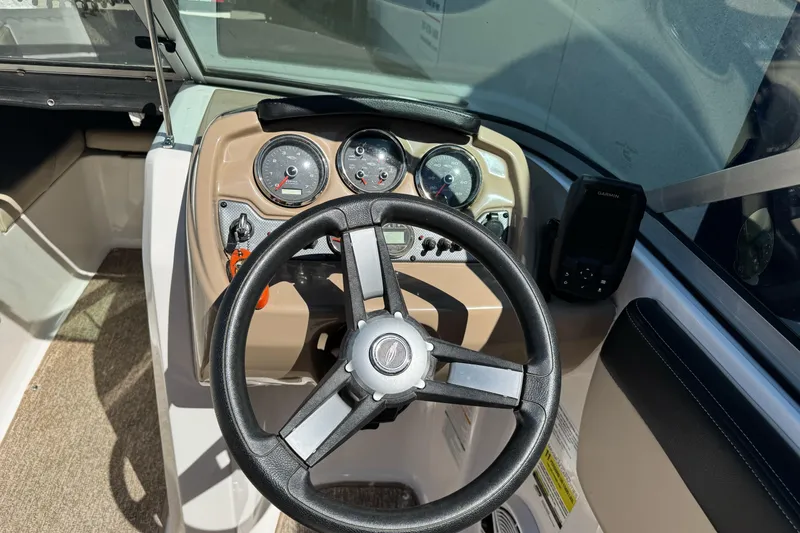 Slide: The Image of 2018 Chaparral 19 H2O Ski & Fish dashboard with steering wheel and gauges. - 14