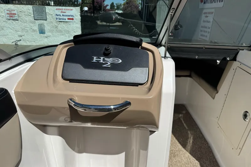 Slide: The Image of 2018 Chaparral 19 H2O Ski & Fish boat interior with H2O logo on dashboard. - 17