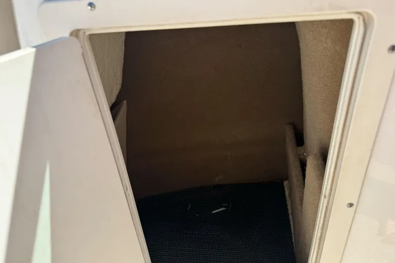 Slide: The Image of Storage compartment inside a 2018 Chaparral 19 H2O Ski & Fish boat. - 23