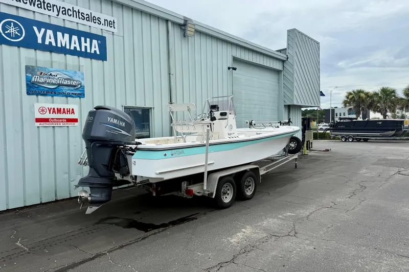 Slide: The Image of 2005 BlackJack 224 boat on trailer outside Yamaha service center. - 2