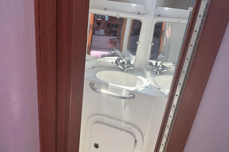 Slide: The Image of Bathroom sink and mirror. - 21