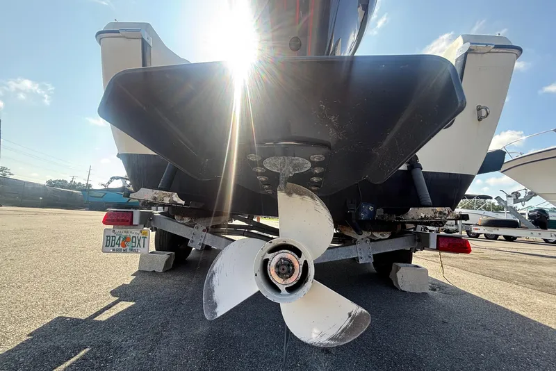 Slide: The Image of A 2013 C-Dory 22' Cruiser on a trailer, with a propeller in the foreground. - 4