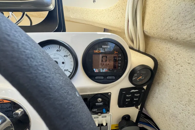 Slide: The Image of Dashboard of a 2013 C-Dory 22' Cruiser with Yamaha gauges and controls. - 36