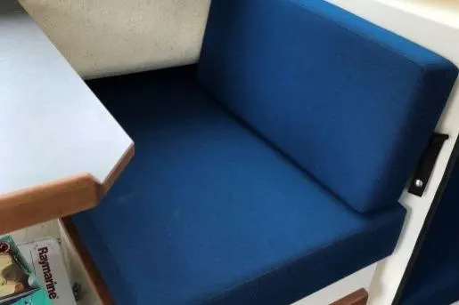 Slide: The Image of Blue cushioned seating in 2013 C-Dory 22' Cruiser boat interior. - 7
