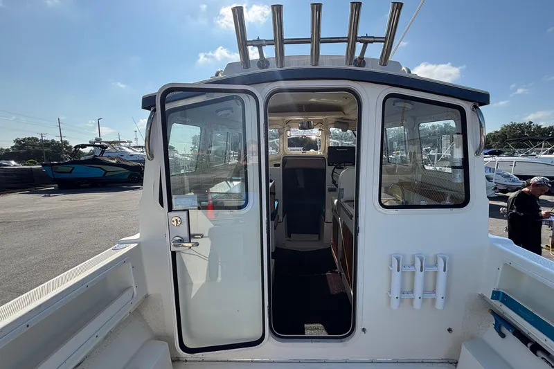 Slide: The Image of The 2013 C-Dory 22' Cruiser features an open cabin door revealing the interior. - 8