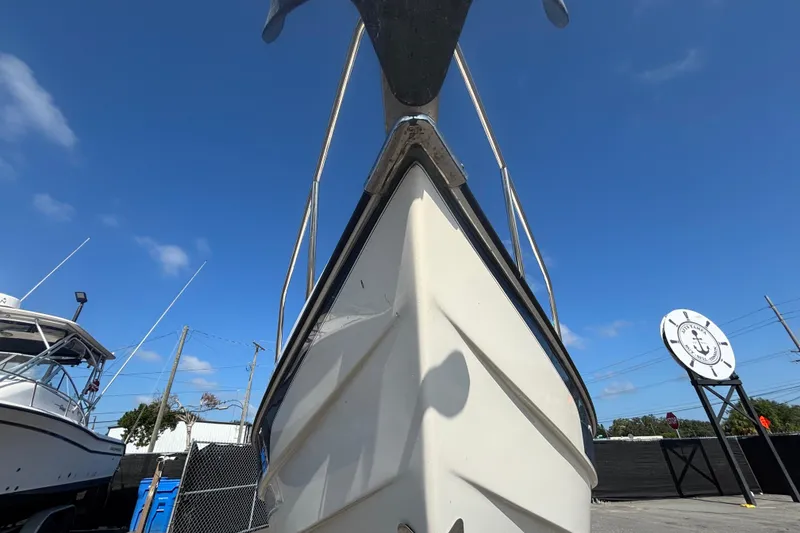 Slide: The Image of 2013 C-Dory 22' Cruiser boat, docked under clear blue sky. - 6