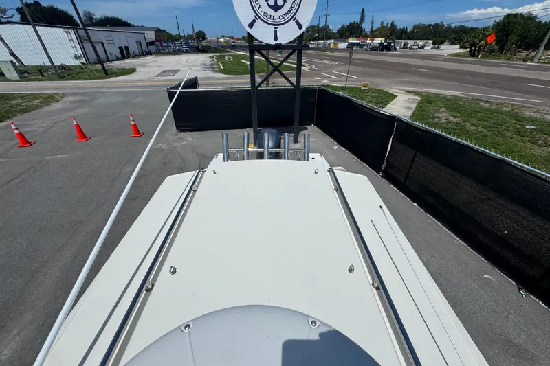 Slide: The Image of 2013 C-Dory 22' Cruiser boat on trailer, parked near road with traffic cones. - 19