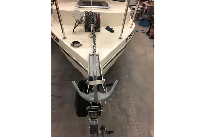 Slide: The Image of 2013 C-Dory 22' Cruiser boat with anchor and chain on trailer in garage. - 5