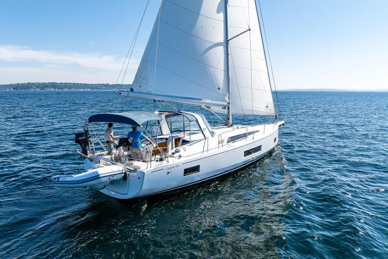 Slide: The Image of 2019 Beneteau Oceanis 46.1 sailing on open water under clear blue skies. - 3