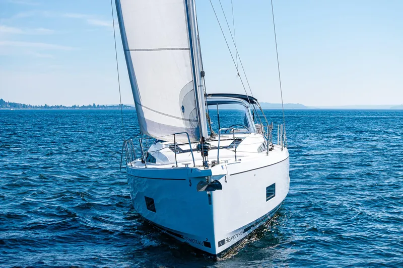 Slide: The Image of 2019 Beneteau Oceanis 46.1 sailing on open blue waters under clear skies. - 6