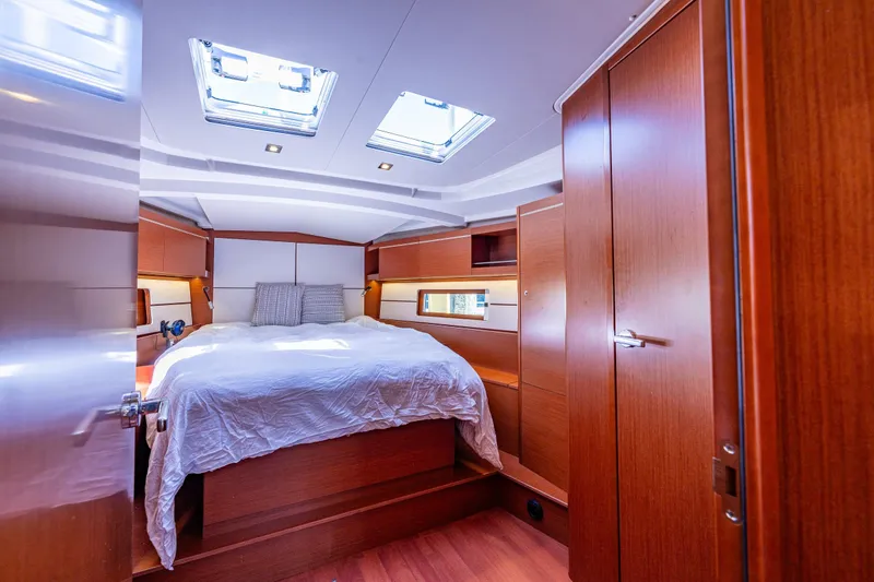 Slide: The Image of Luxurious cabin interior of 2019 Beneteau Oceanis 46.1 yacht with skylights and wood finish. - 27