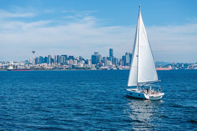 Slide: The Image of Sailboat Beneteau Oceanis 46.1, 2019, cruising near city skyline on a sunny day. - 1