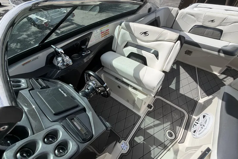 Slide: The Image of Interior of a 2013 Monterey 328SS Super Sport boat with modern seating and controls. - 11