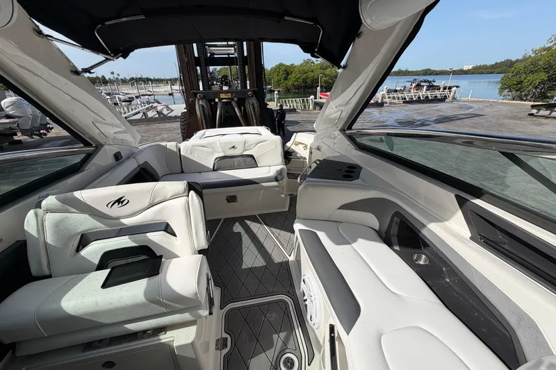 Slide: The Image of Interior view of a 2013 Monterey 328SS Super Sport boat with luxurious seating. - 7