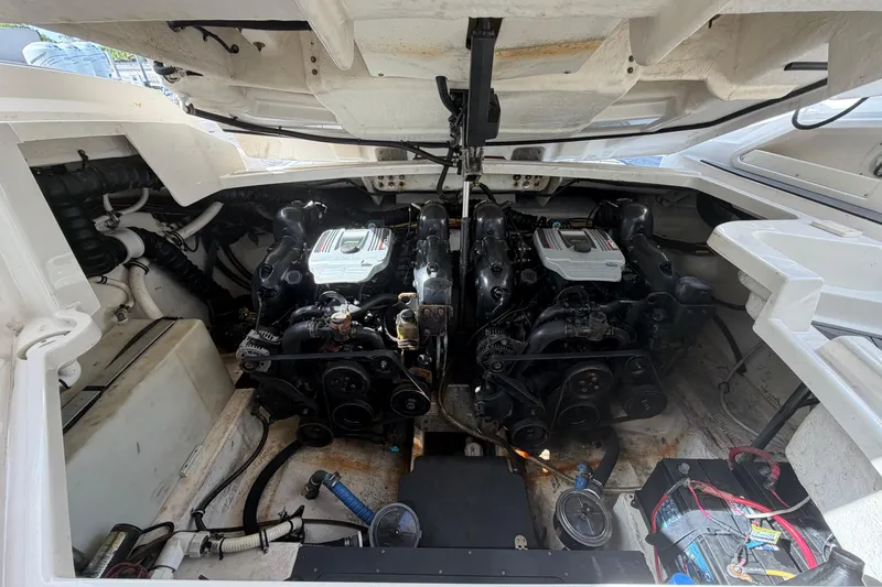 Slide: The Image of Engine compartment of a 2013 Monterey 328SS Super Sport boat, showcasing dual engines. - 20