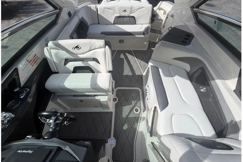 Slide: The Image of Interior of a 2013 Monterey 328SS Super Sport boat with luxurious seating and steering wheel. - 12