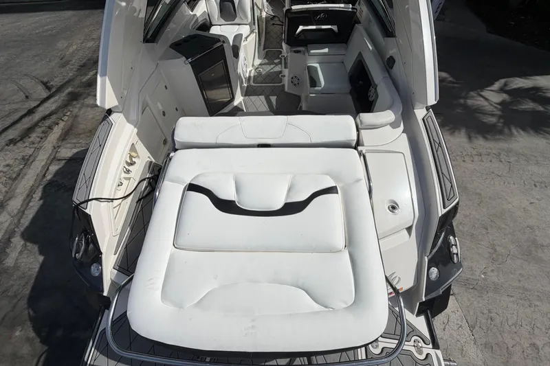 Slide: The Image of 2013 Monterey 328SS Super Sport boat interior with white seating and modern amenities. - 17