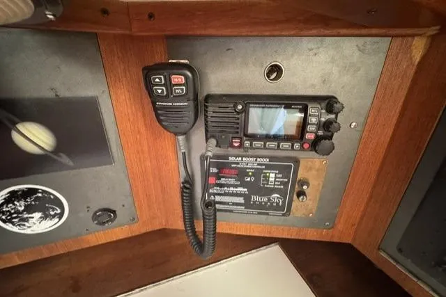Slide: The Image of Control panel of a 1990 J Boats J/37 with radio and solar boost system. - 26