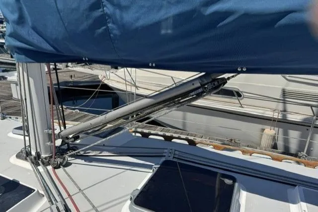 Slide: The Image of Sailboat deck of 1990 J Boats J/37 with blue sail cover and rigging. - 9