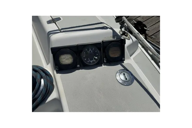 Slide: The Image of 1990 J Boats J/37 cockpit instruments and deck details with rope and fittings. - 14