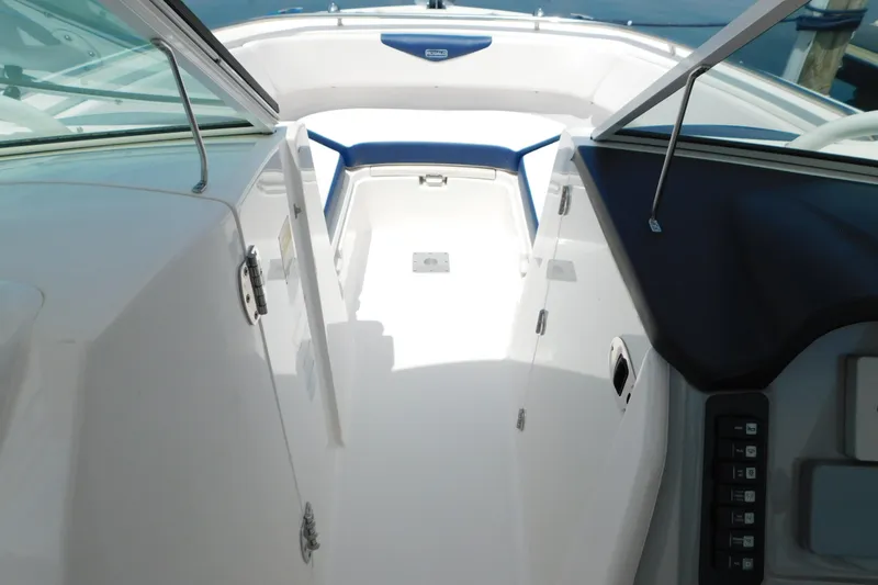 Slide: The Image of 2018 Robalo R247 Dual Console boat interior with open deck and seating. - 48