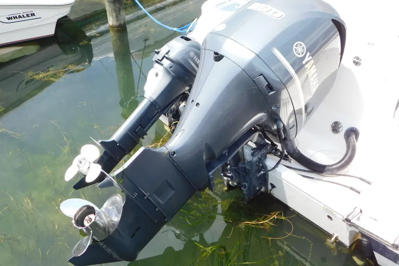 Slide: The Image of 2018 Robalo R247 Dual Console with Yamaha outboard motor in water. - 4