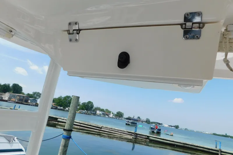 Slide: The Image of 2018 Robalo R247 Dual Console boat detail with scenic waterfront view. - 69