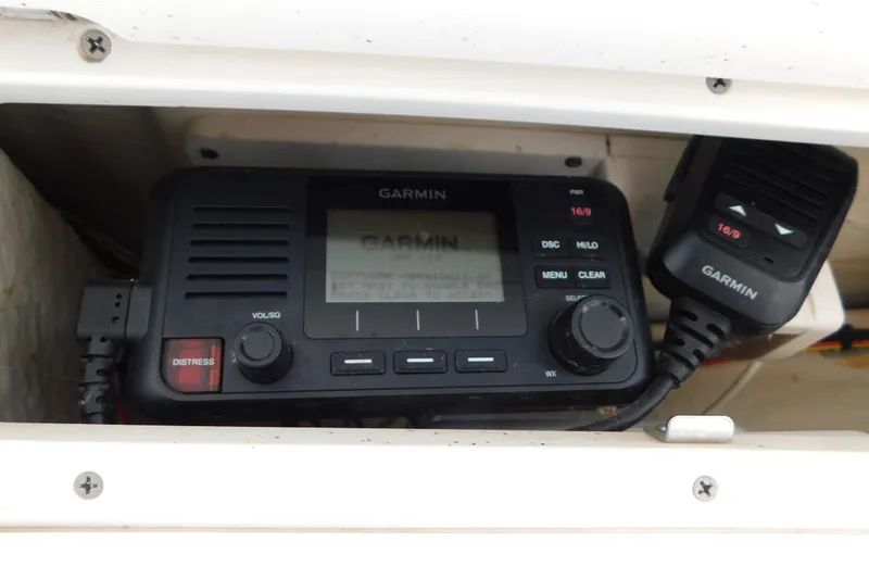Slide: The Image of Garmin marine radio installed on a 2018 Robalo R247 Dual Console boat. - 27