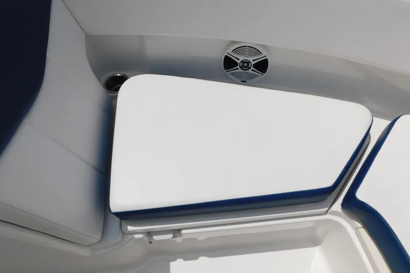 Slide: The Image of 2018 Robalo R247 Dual Console boat seating with speaker detail. - 58