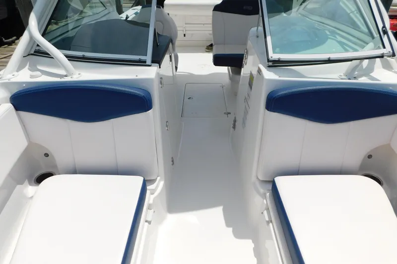 Slide: The Image of 2018 Robalo R247 Dual Console boat interior with blue and white seating. - 63