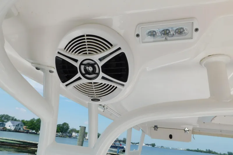 Slide: The Image of 2018 Robalo R247 Dual Console boat speaker and LED lights on deck. - 23