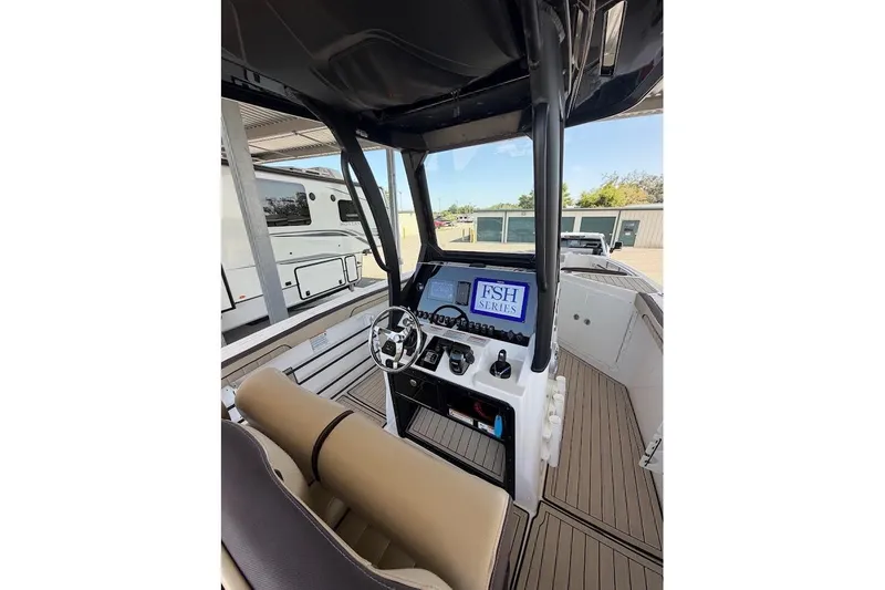 Slide: The Image of 2024 Yamaha Boats 255 FSH Sport H cockpit with modern controls and steering wheel. - 20